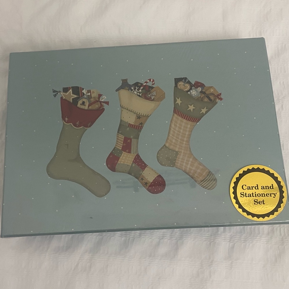 vintage Christmas boxed card and stationery set. 
It includes 16 cards